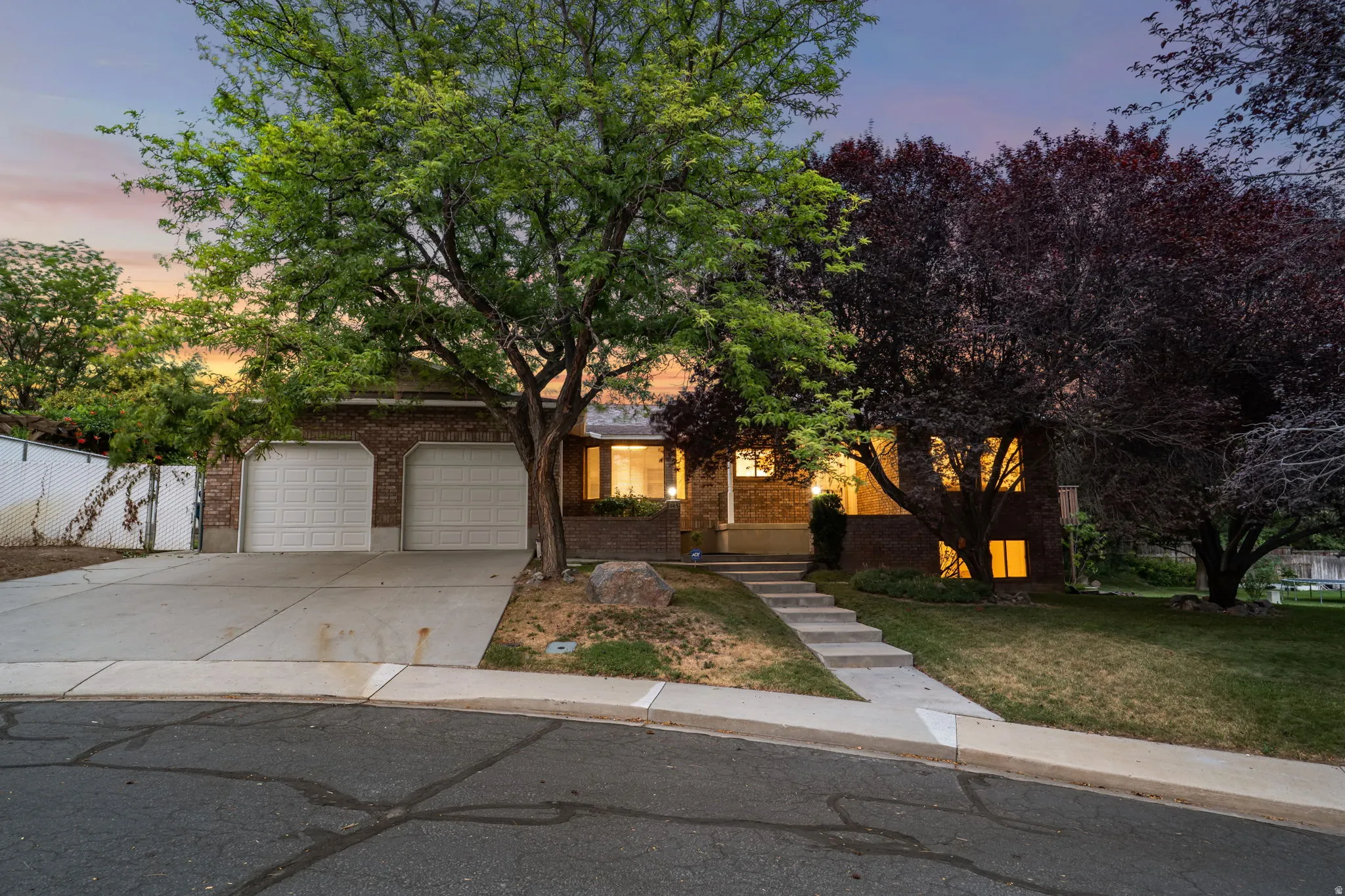 Brick exterior with a prominent two-car garage