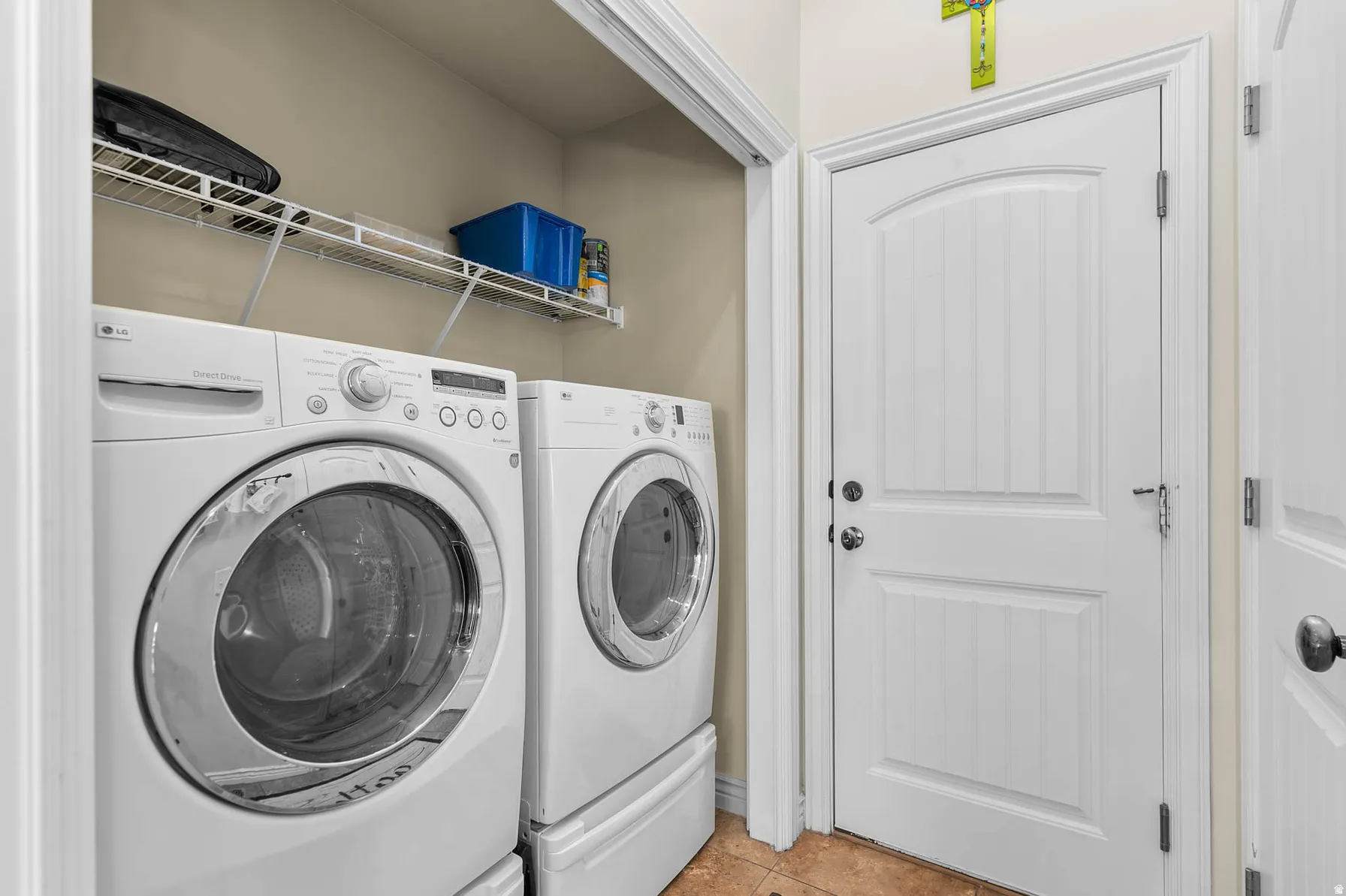 Dedicated laundry area featuring front-loading washer and dryer units