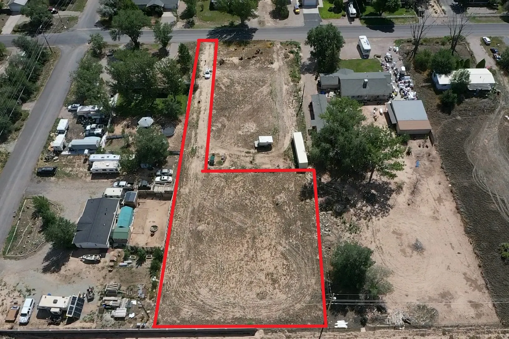 Expansive undeveloped land parcel featuring a visible boundary line