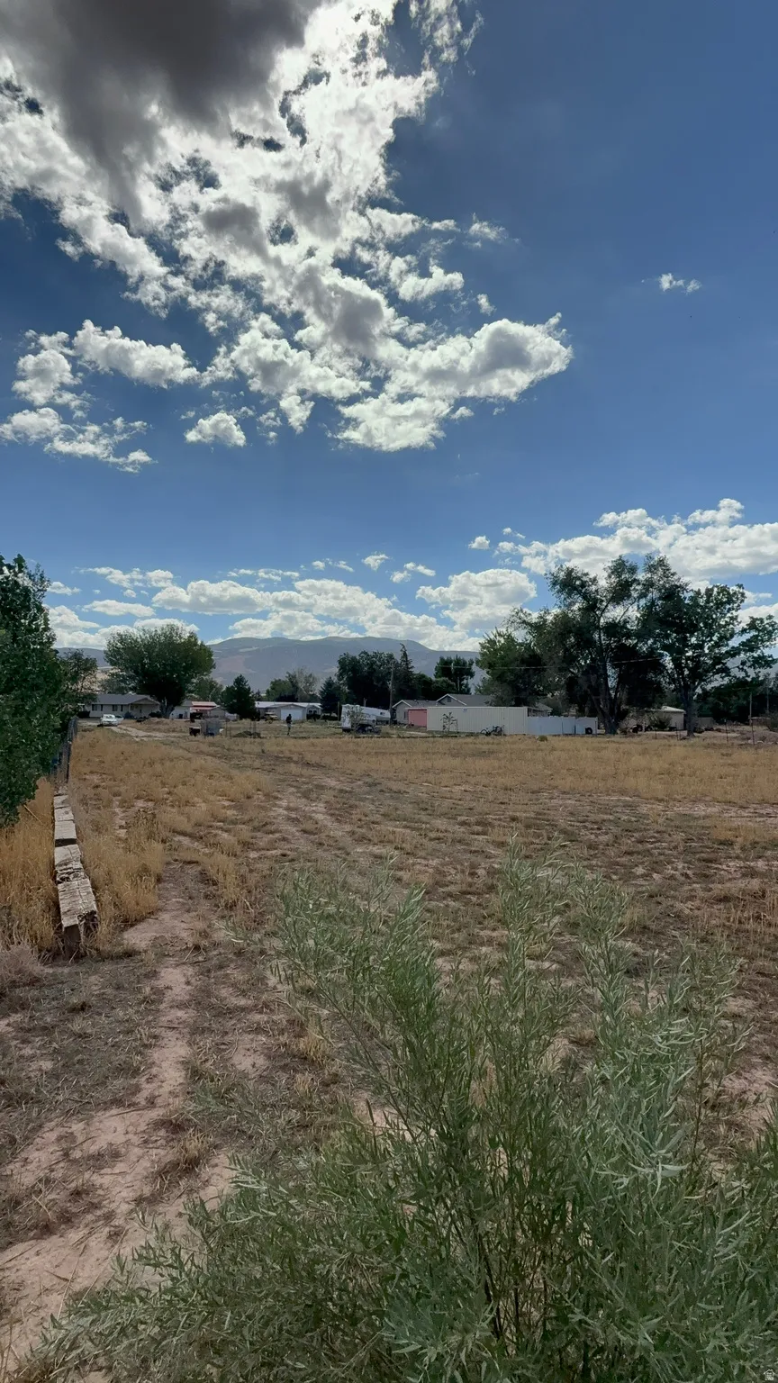 Expansive lot featuring open terrain and distant mountain scenery