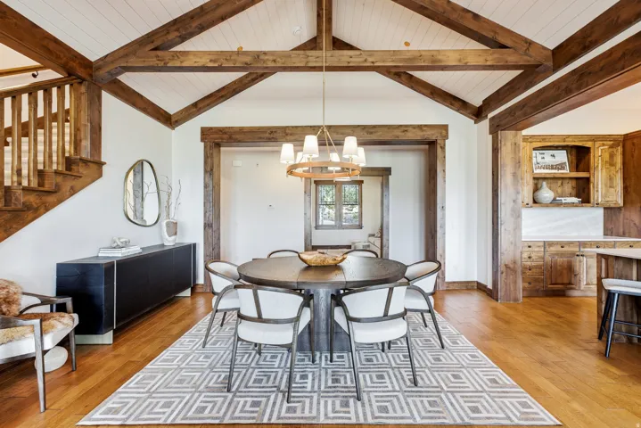 Vaulted ceiling with exposed wood beams and white planking