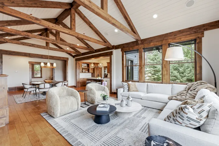 Vaulted white-paneled ceilings with exposed wood beams