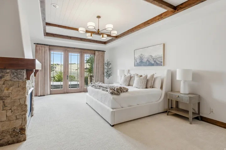 Recessed ceiling with exposed wood beams and shiplap detailing