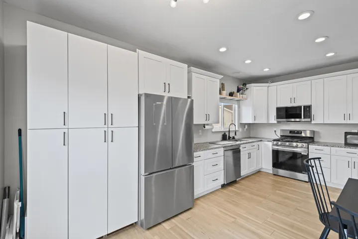 Kitchen featuring large cabinets.