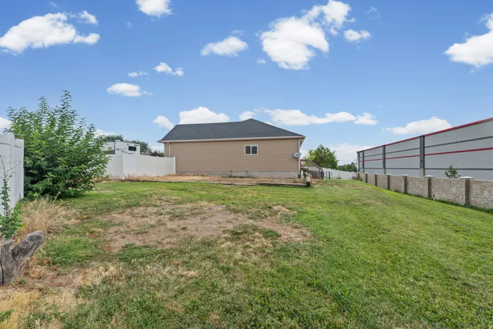 Expansive outdoor space featuring a large lawn area