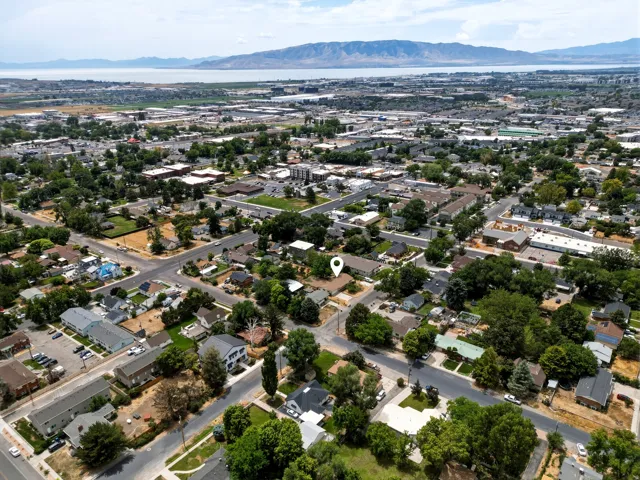 Aerial perspective showcasing a residential neighborhood with established trees and surrounding streets