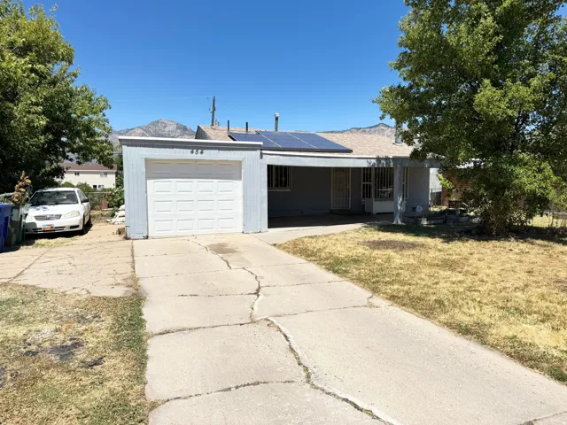 Single-story residence featuring an attached garage and a covered front entry