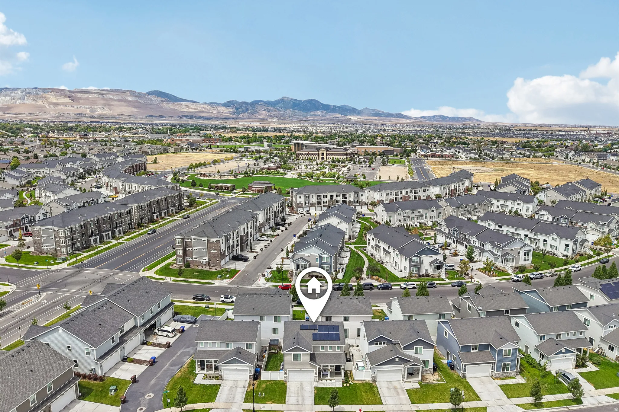 Aerial view of a residential neighborhood with mountain scenery
