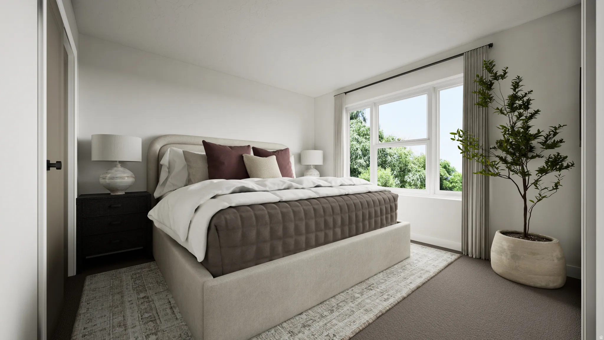 Generous room featuring a large window, light-toned walls, and a combination of patterned area rug and carpet flooring