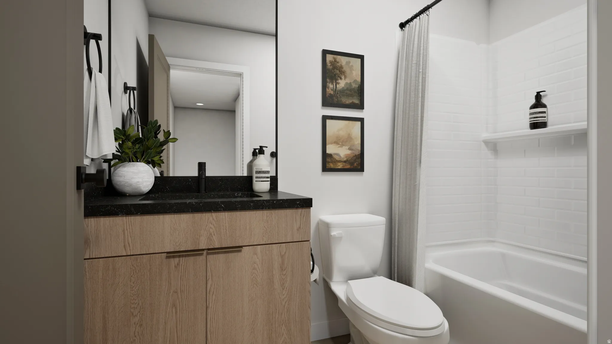 Modern bathroom featuring a wood-finish vanity with a black countertop, a full-width mirror, and a white subway tile tub surround