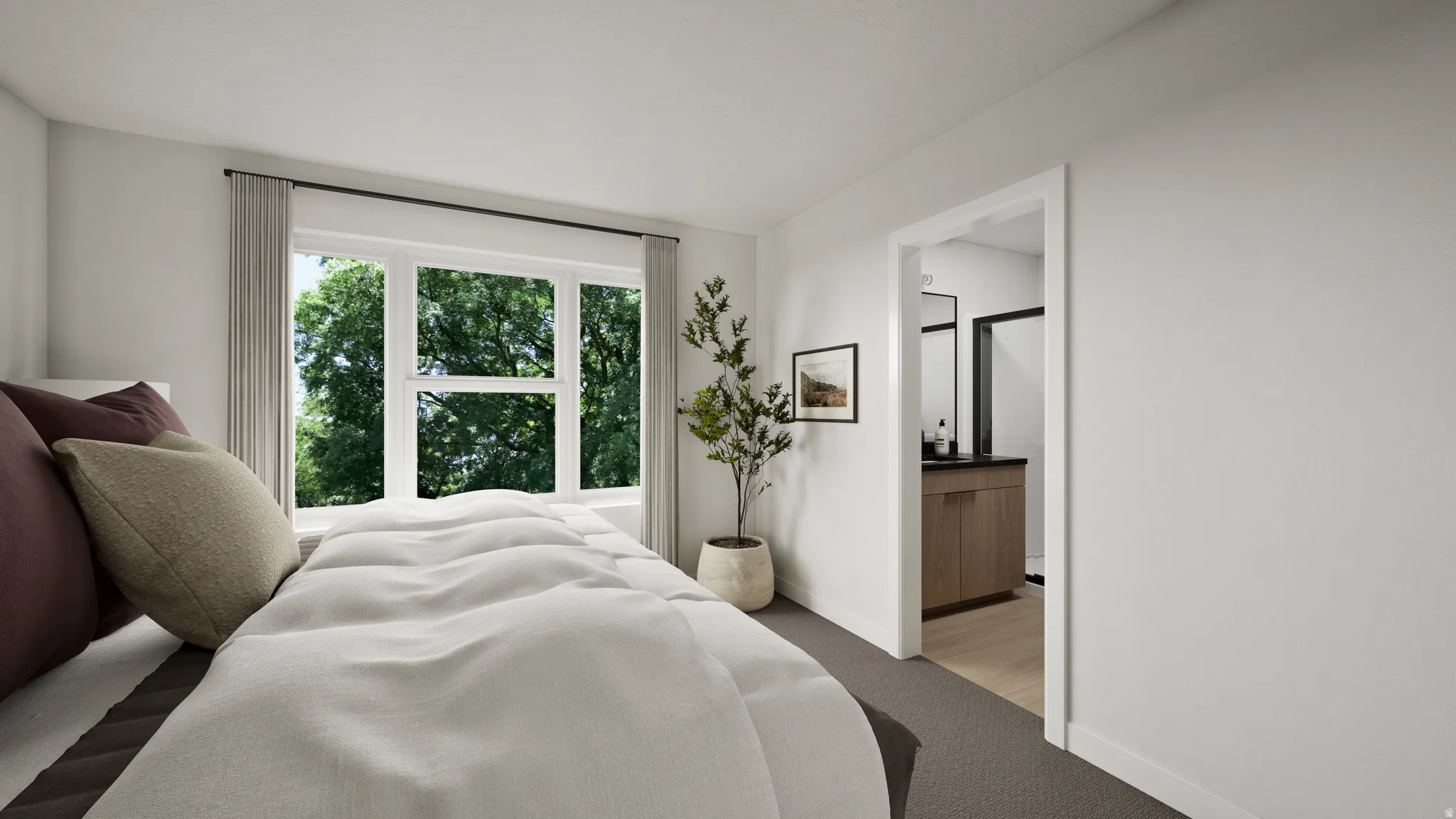 Bedroom featuring a large window, white walls, and dark gray carpeting