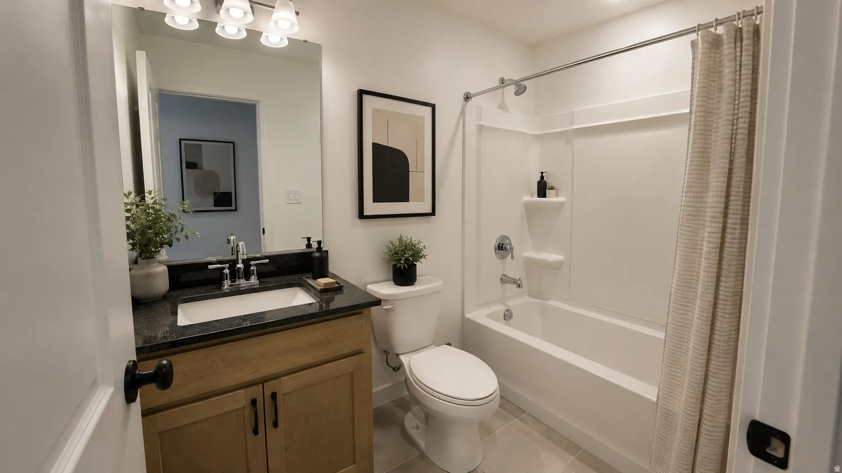 Bathroom featuring a single vanity with granite countertop, integrated sink, and brushed nickel faucet