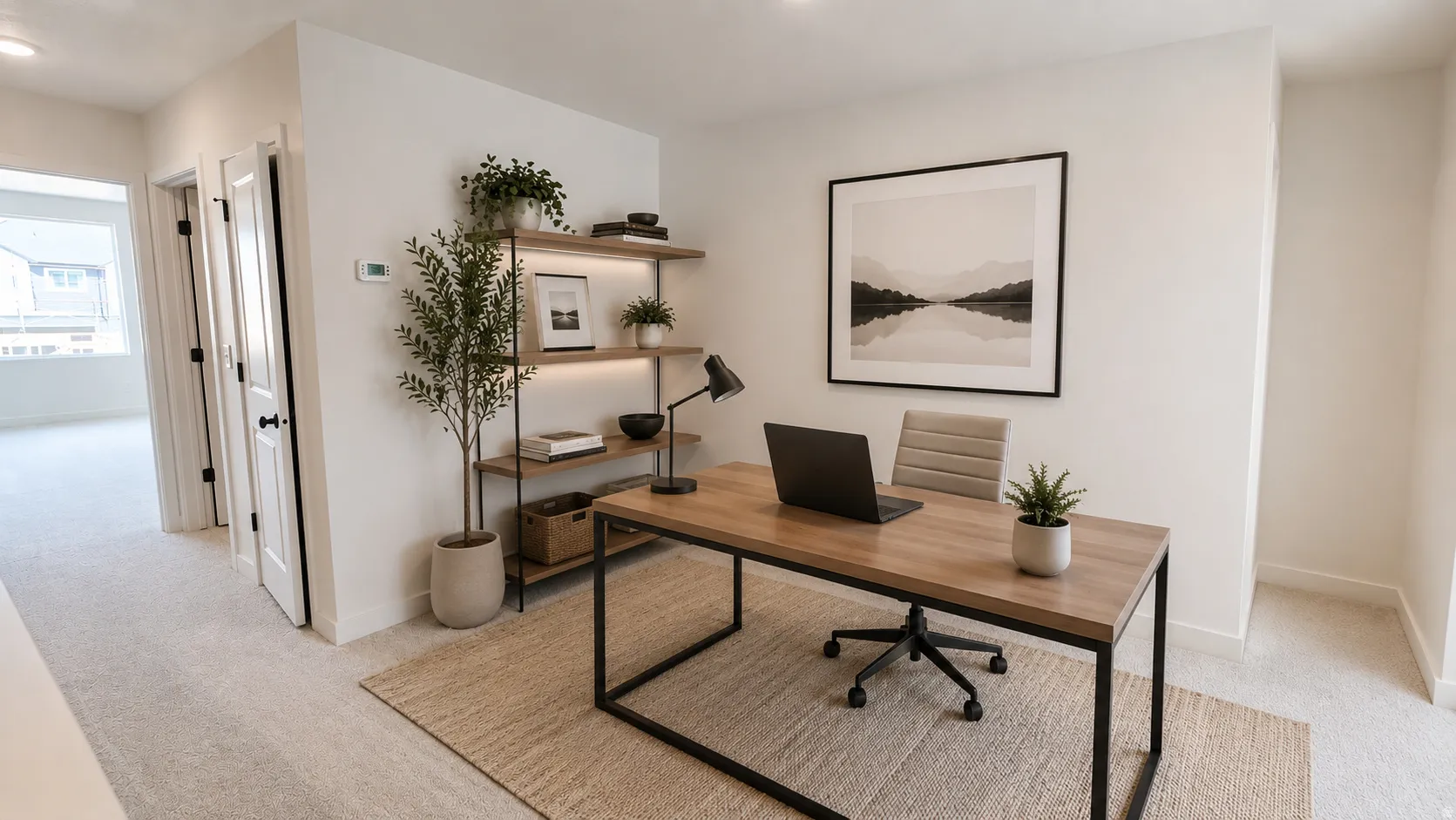 Dedicated office space featuring light-colored carpeting, a built-in shelving unit with integrated lighting, a large window providing natural light, and a neutral color palette