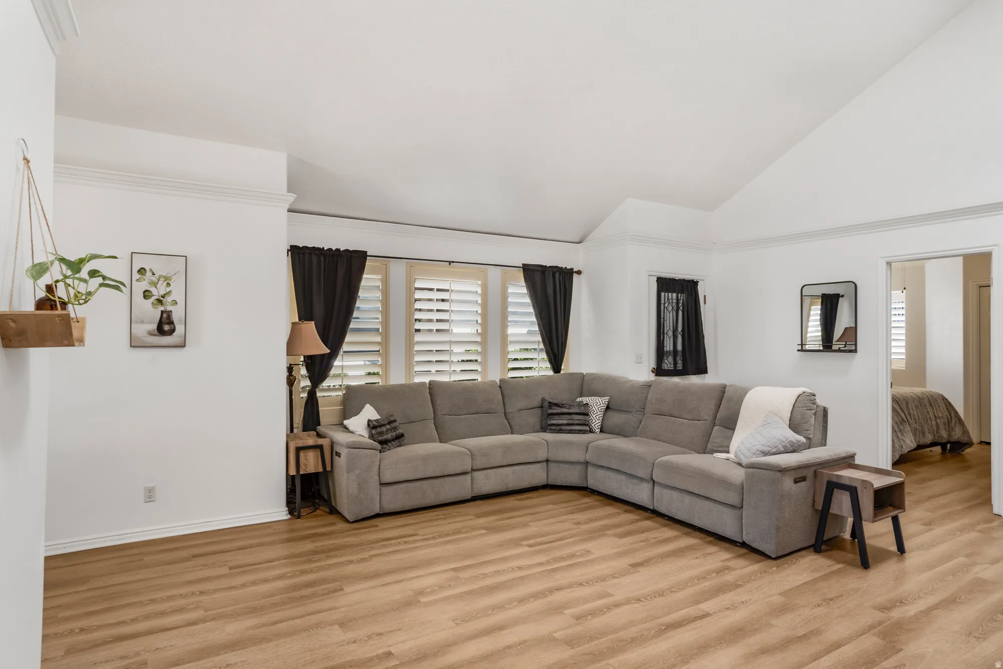 Bright interior space featuring wood-finish flooring and white walls