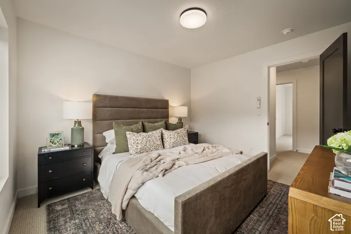 Neutral wall color, carpeted flooring, flush-mount ceiling lighting, and solid-core interior doors
