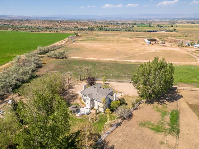 Expansive property featuring a multi-level residence, a covered patio, and a gazebo