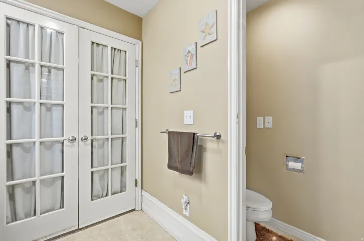 White French doors with glass panes and polished chrome hardware