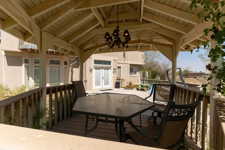 Covered wood-finish deck with built-in chandelier