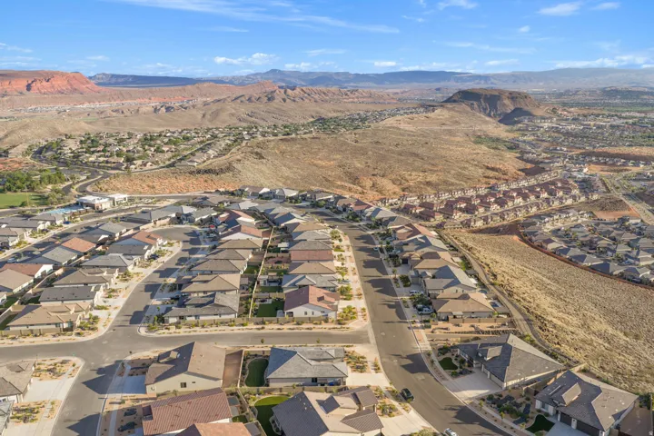 Residential neighborhood featuring a mix of single-story and multi-story homes with varied rooflines and a contemporary architectural style