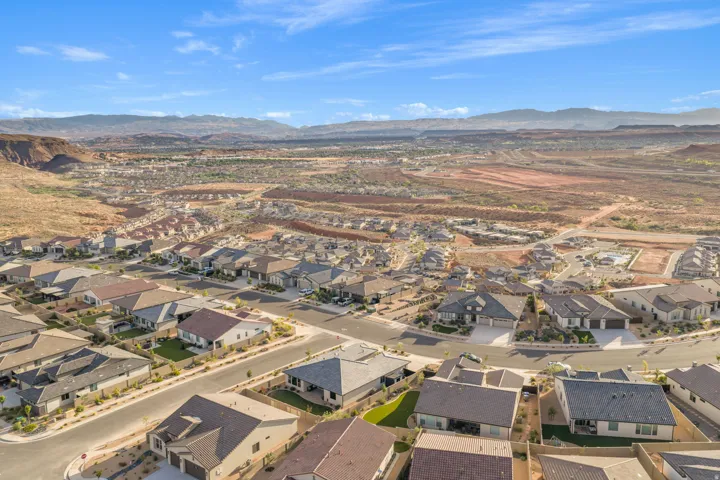 Expansive aerial perspective showcasing a residential community with contemporary single-story homes