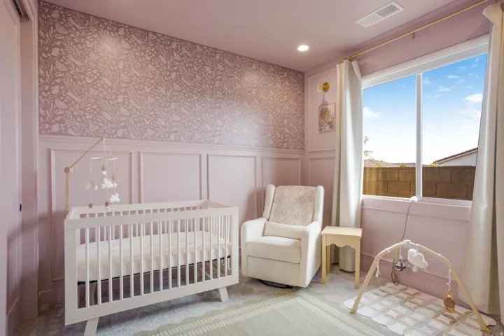 Bedroom featuring board and batten wall paneling, patterned wallpaper, recessed lighting, and a large window with white curtains