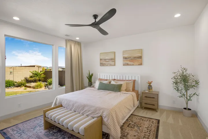 Spacious room featuring a large picture window, recessed lighting, and a modern ceiling fan