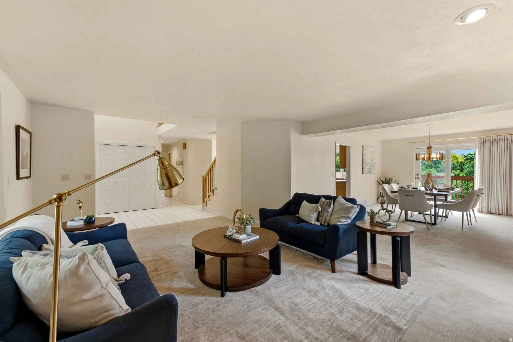 Recessed ceiling lighting, durable carpeting, sliding glass door, and a built-in staircase