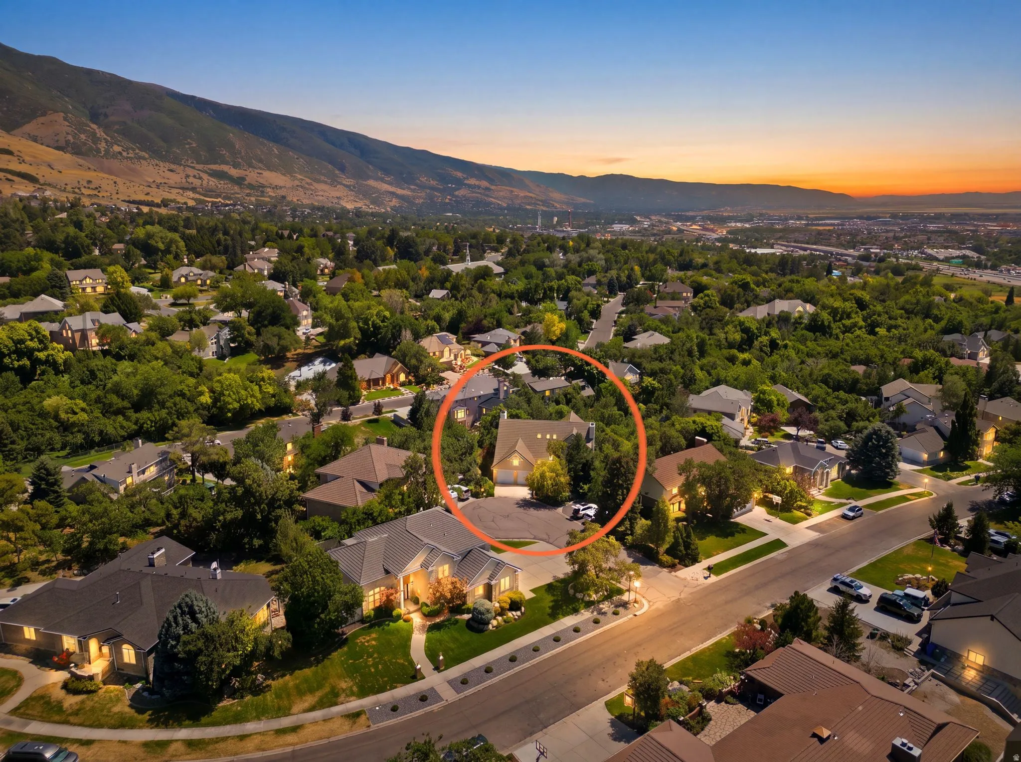Aerial view of a residential neighborhood with a prominent mountain backdrop