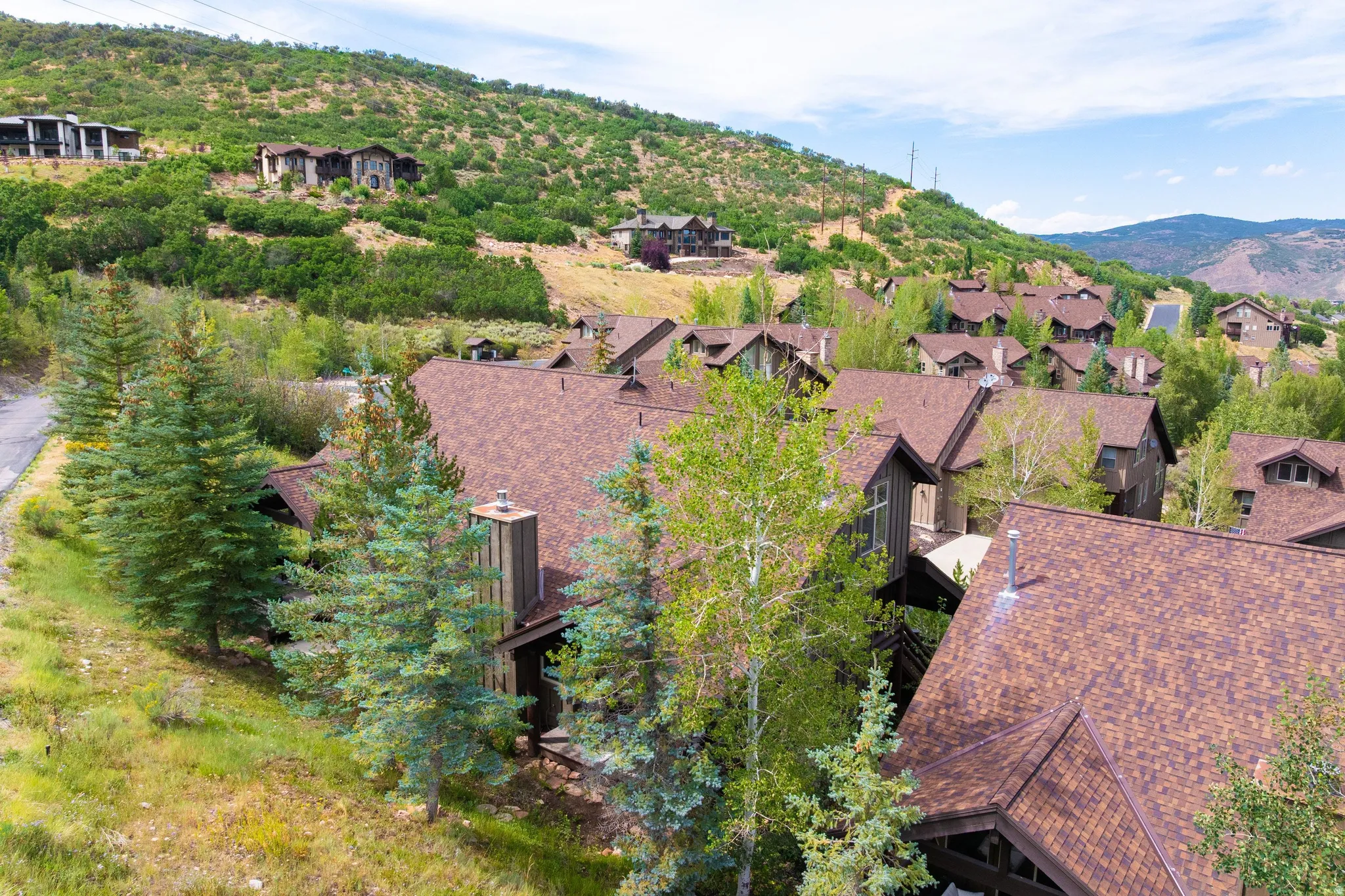 Architectural roofing featuring shingle material and multiple gables