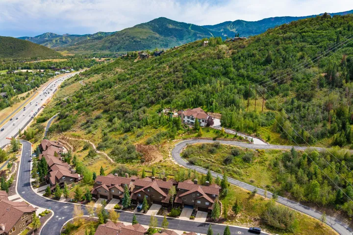 Expansive mountain landscape with diverse topography and abundant tree cover