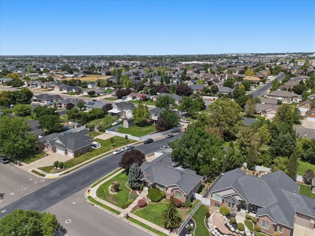 Aerial perspective showcasing a residential area with varied home styles and mature landscaping