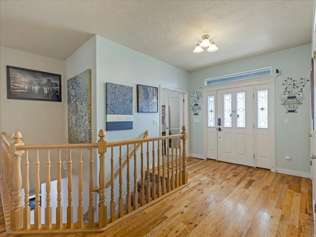 Double entry doors with decorative glass panels and transom window