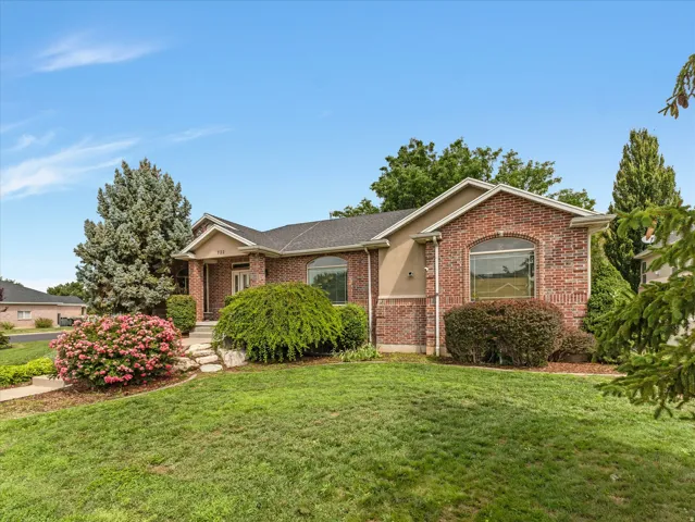 Brick and stucco exterior with an arched window