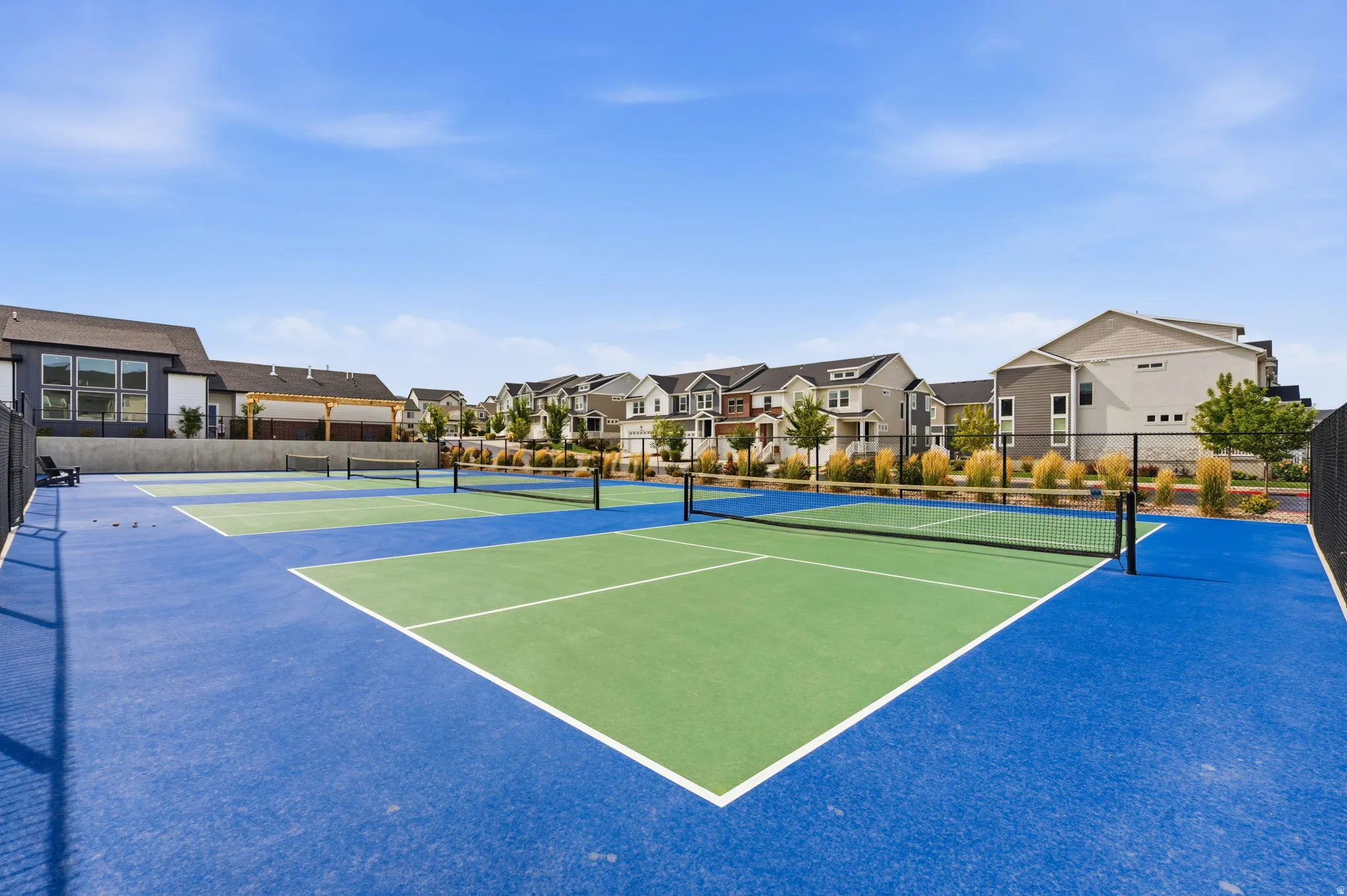 Outdoor recreational courts featuring blue and green surfacing