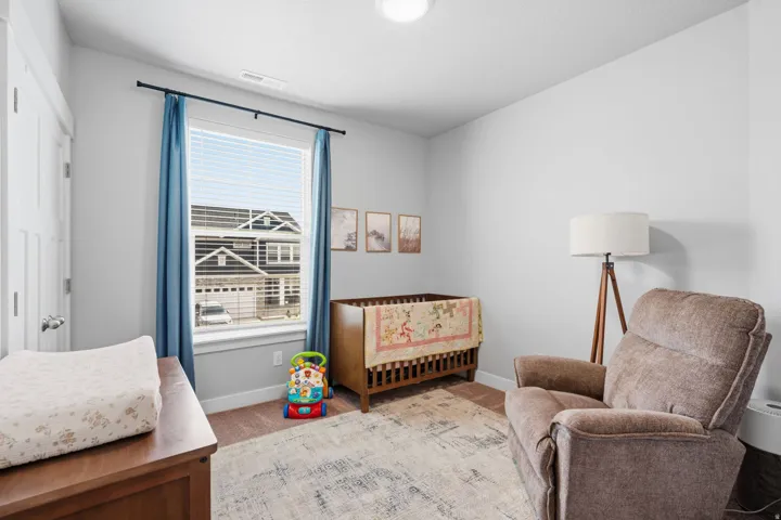 Bright room featuring neutral wall tones and a window with blinds