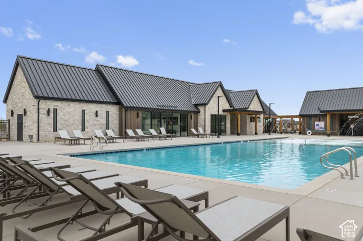 Expansive outdoor pool with integrated water features