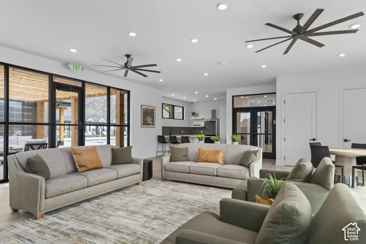 Spacious open-concept common area featuring recessed lighting and multiple ceiling fans
