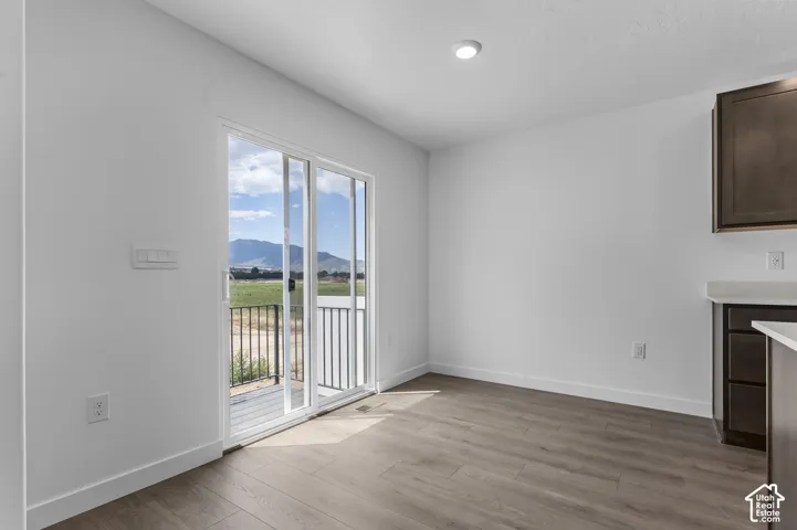 Sliding glass door leading to an outdoor space with metal railing