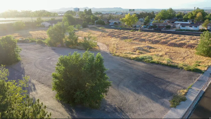 Expansive lot featuring a mix of paved and undeveloped land