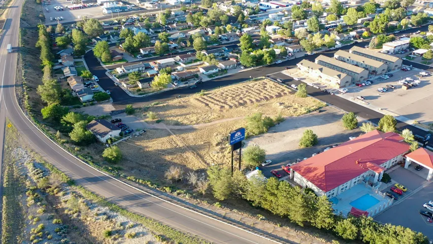 Expansive vacant land parcel featuring clear ground and established road access