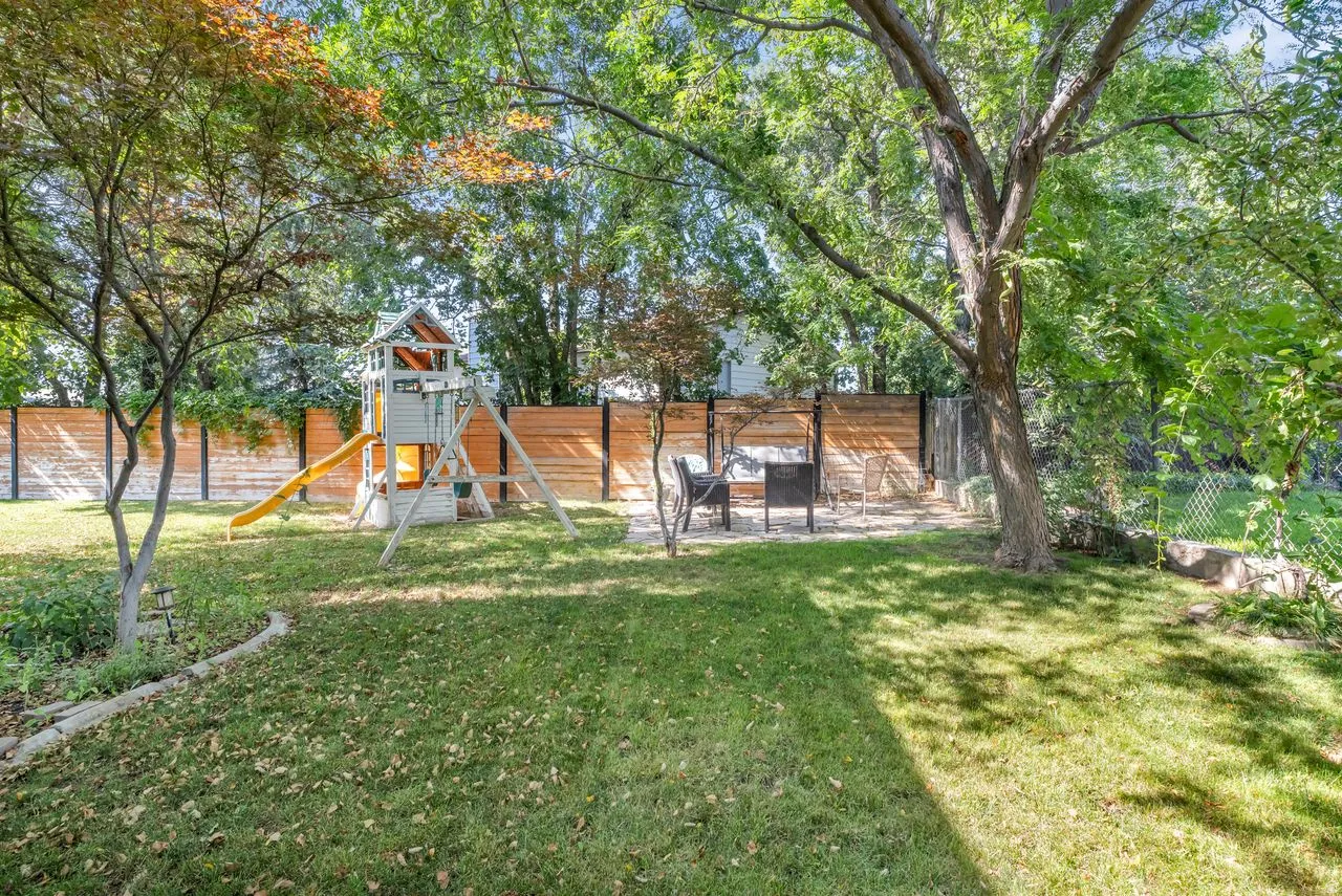 Private backyard featuring and a multi-toned privacy fence