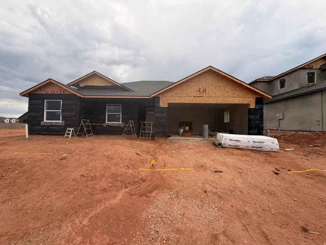 Single-story residence under construction featuring a two-car garage opening