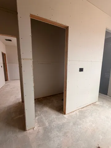 Interior framing with doorways and drywall installation