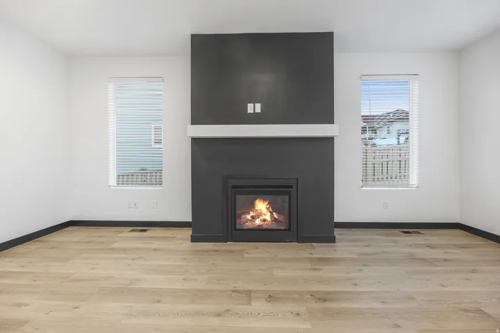 Central fireplace with dark surround and white mantel