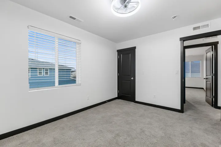 Neutral gray carpeting throughout