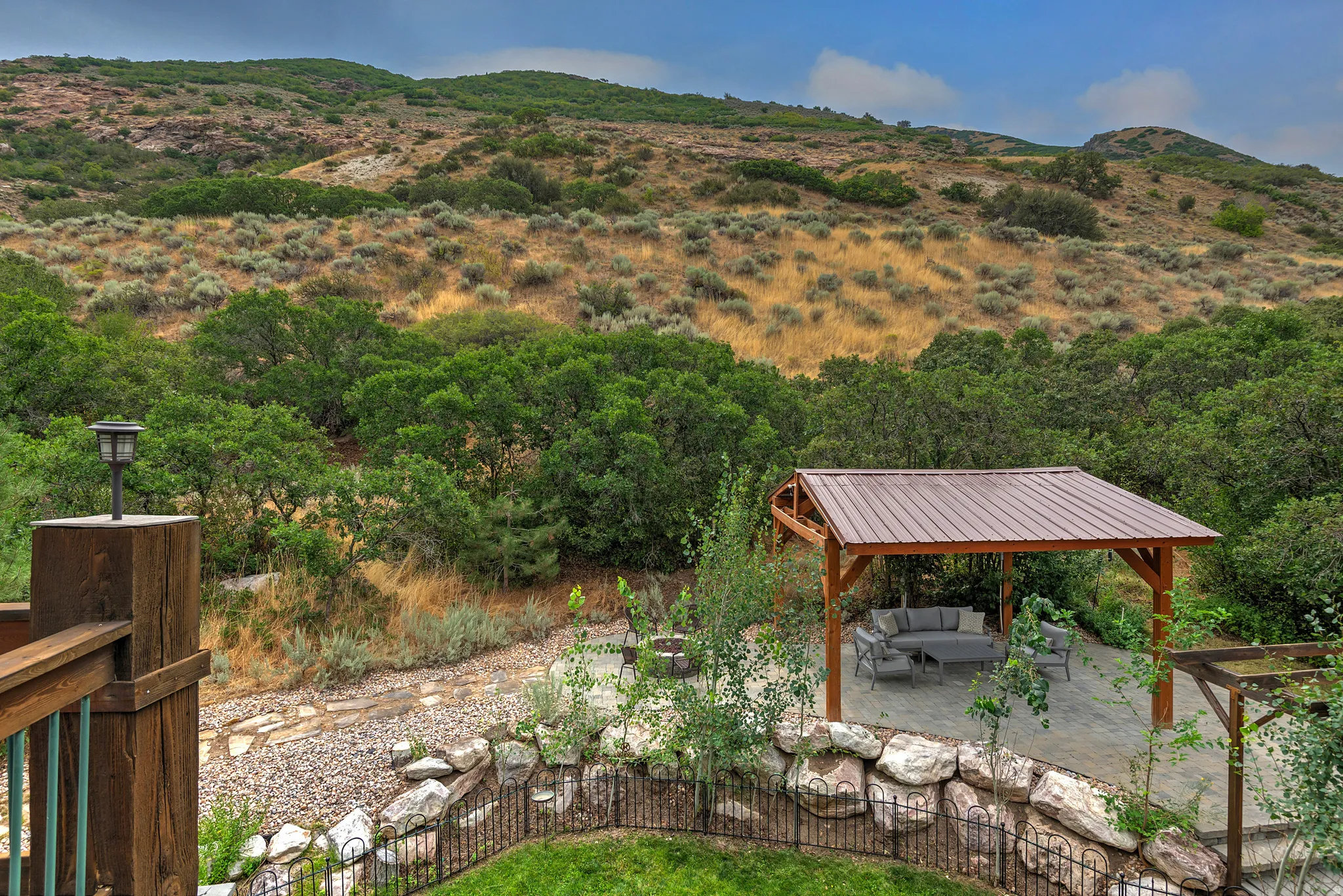 Covered patio with a metal roof and stone paver flooring