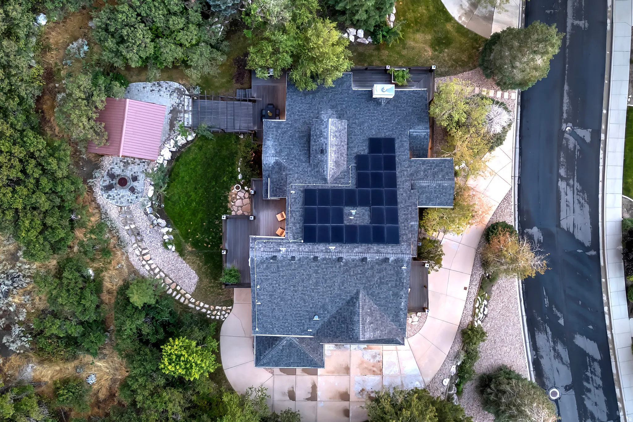 Asphalt shingle roof with integrated solar panels