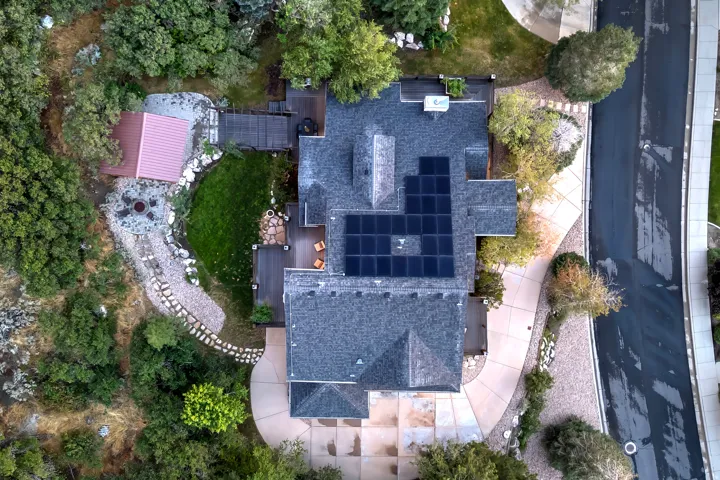 Asphalt shingle roof with integrated solar panels