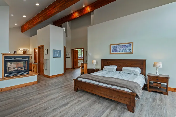 Spacious interior with vaulted ceilings and exposed wood beams