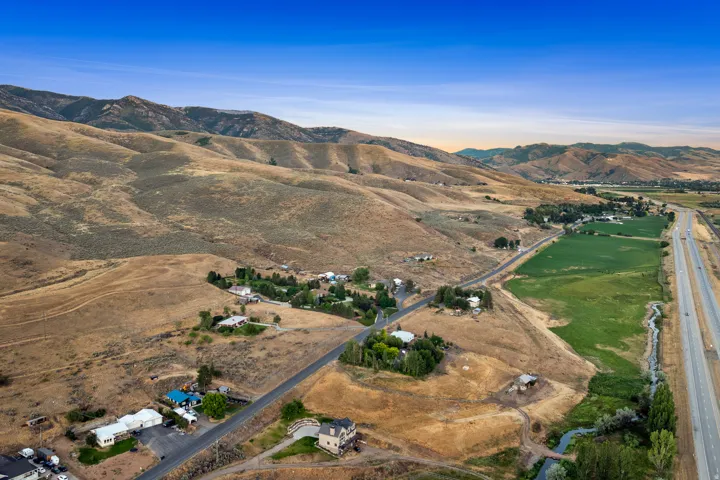 Expansive landscape featuring rolling hills and green pastures